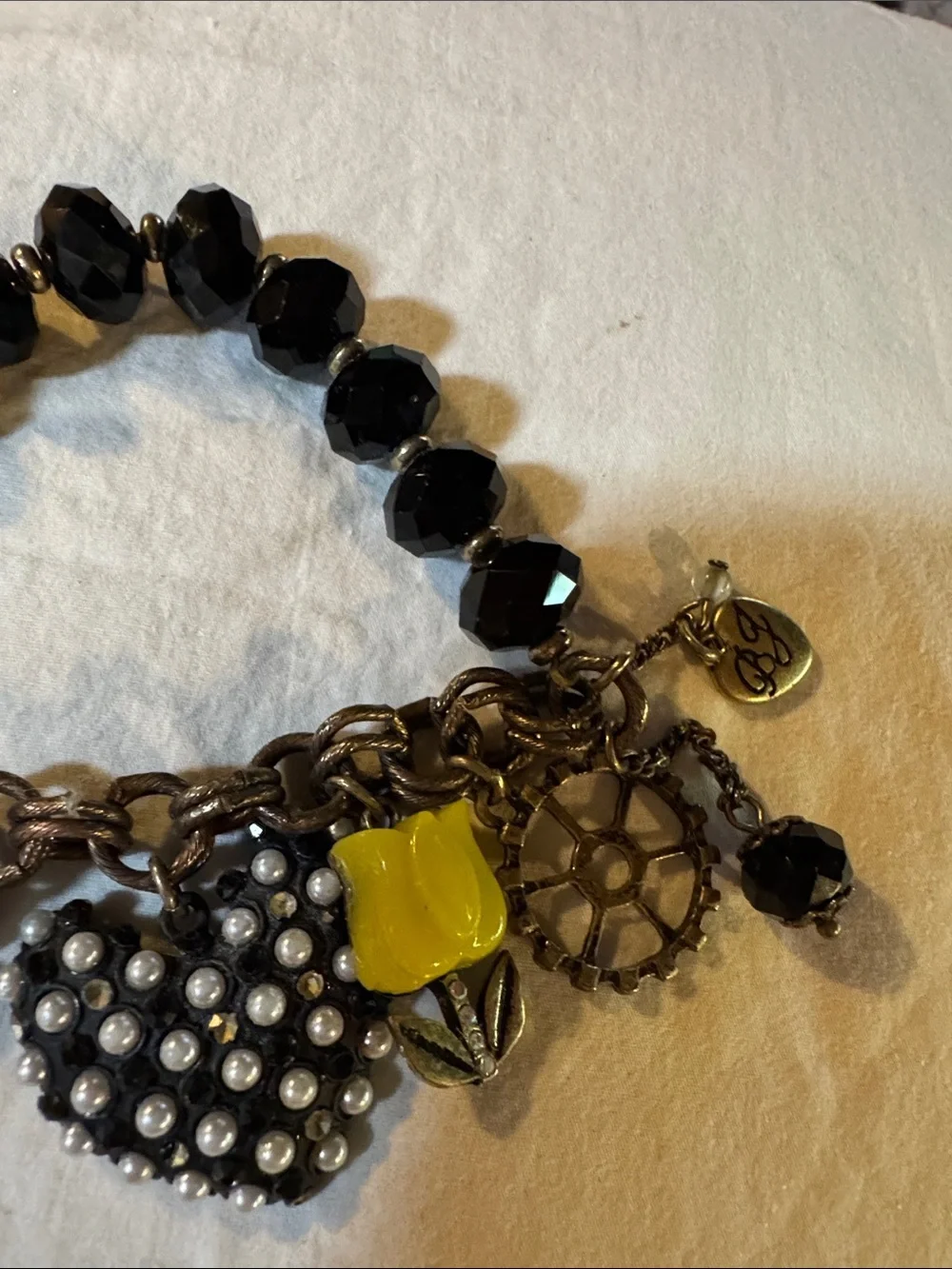 This piece is a RARE vintage Betsey Johnson Y2K COMPLETE Charm Bracelet.